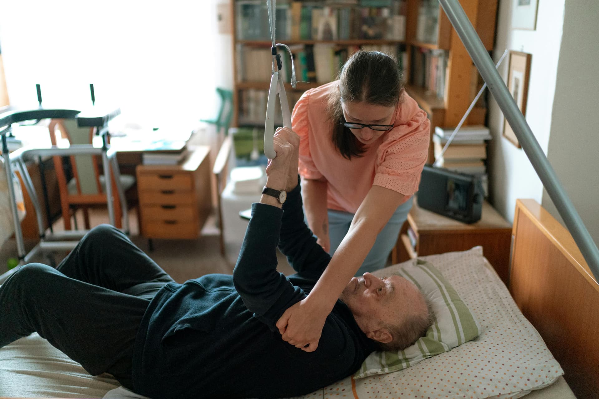 Care professional supporting an older resident